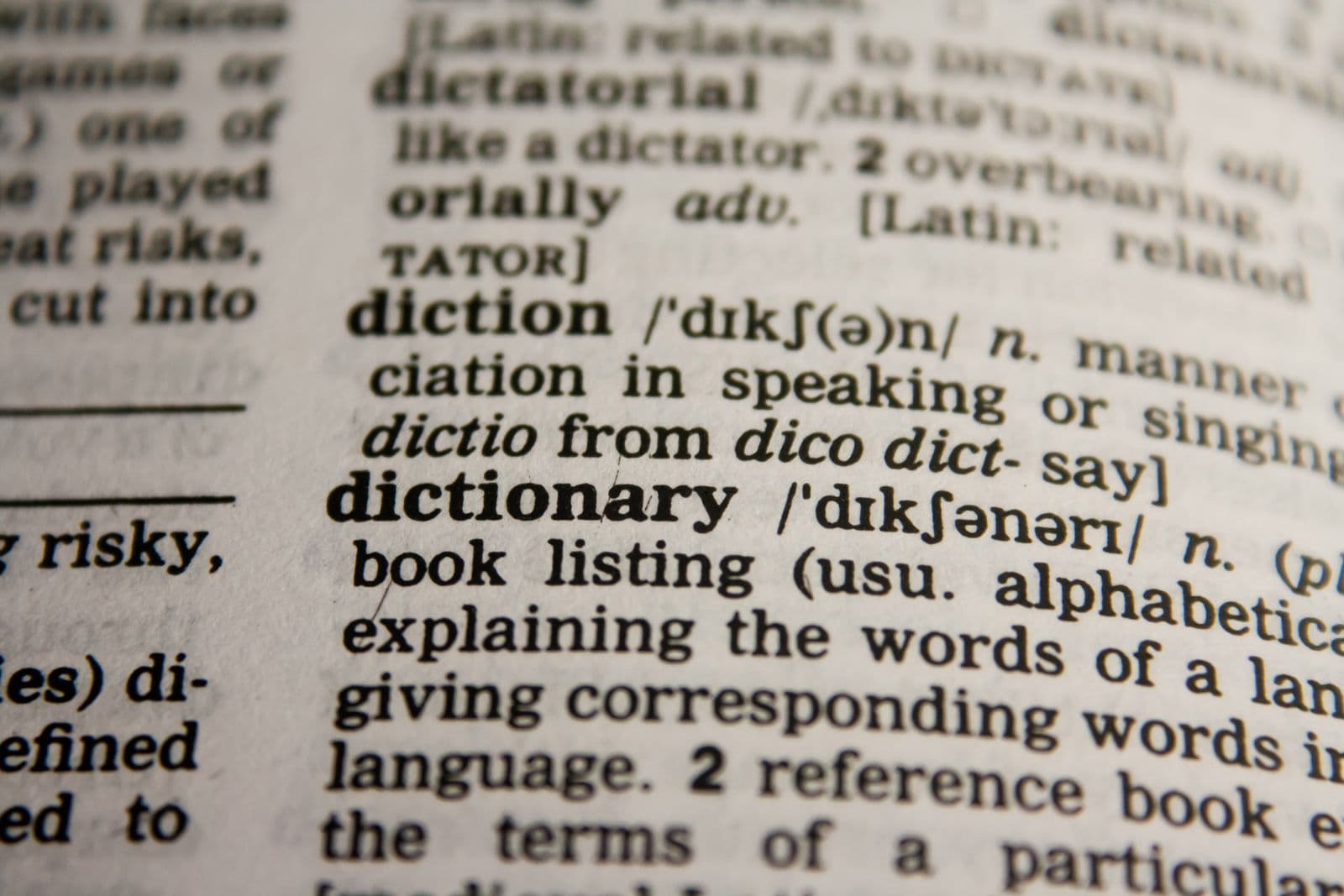 An open dictionary page with the word “dictionary” in focus